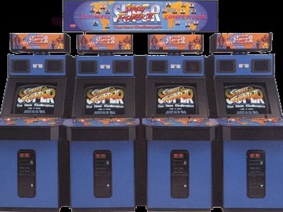 Two players competing side-by-side at a classic Street Fighter II arcade cabinet, eyes fixed on the screen.