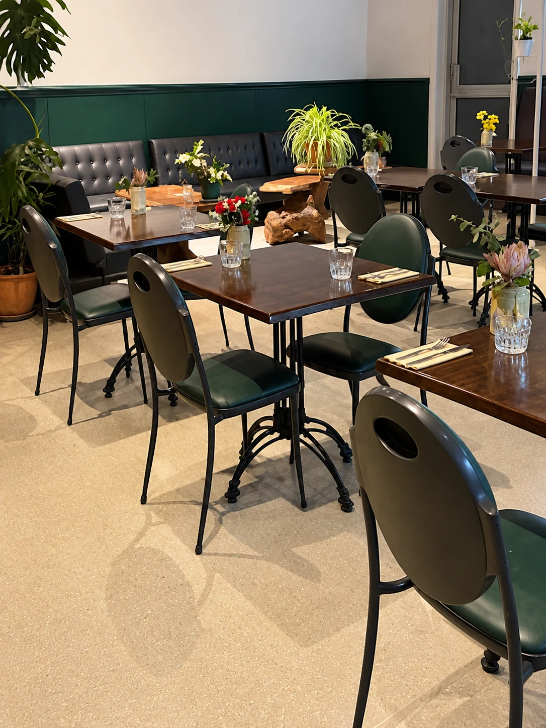 Tables and chairs in the covered seating area at Jay Dee's Cafe.