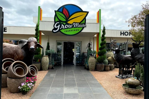 Pots, garden ornaments and plants frame the entrance to Grow Master Traralgon.